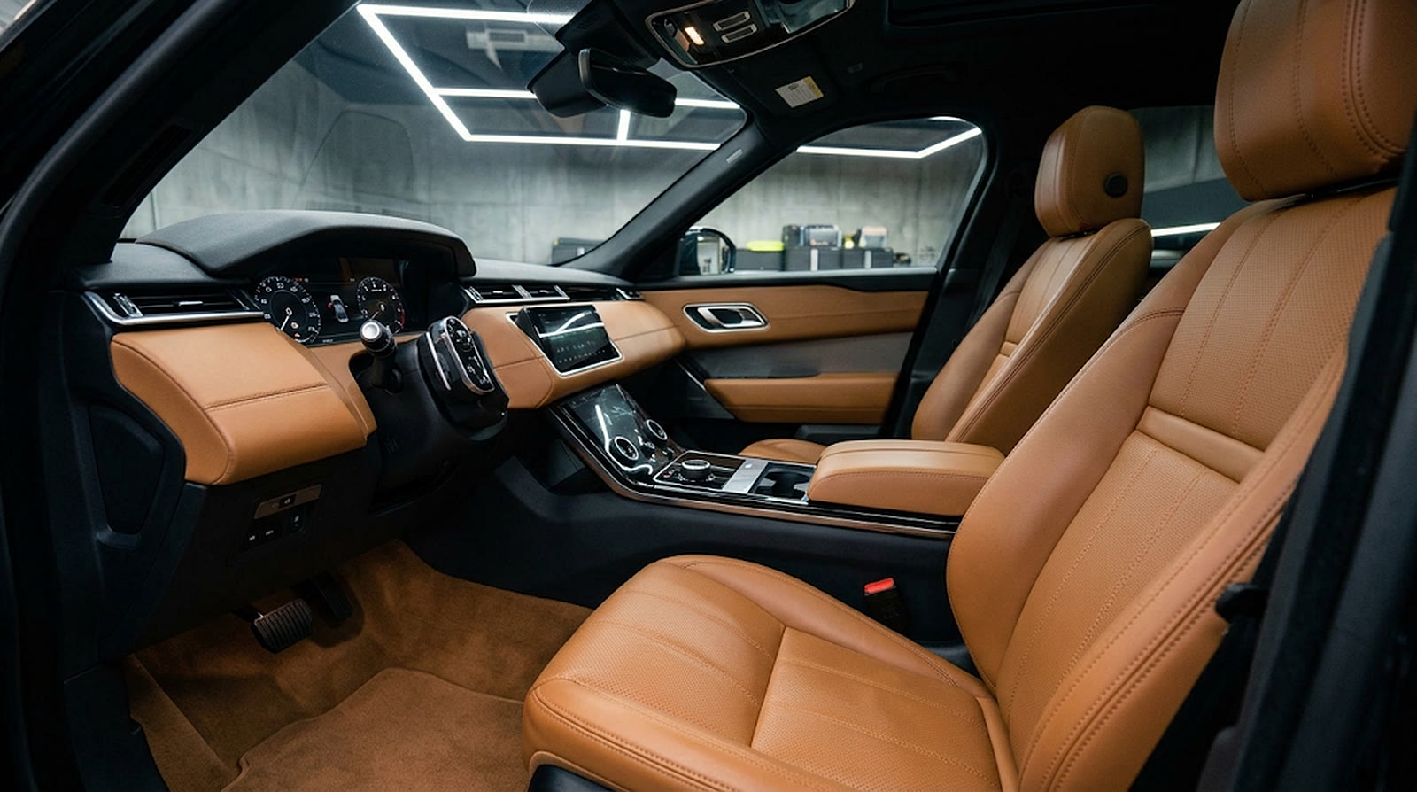 Tan leather front seats after an interior detail