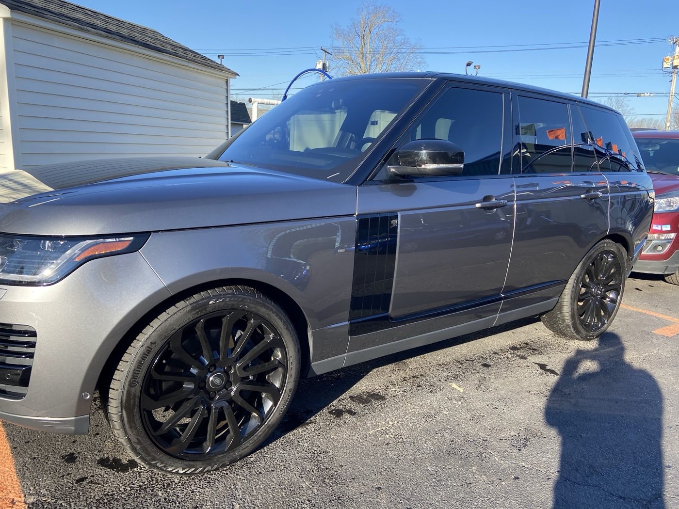 Grey Range Rover with black wheels, washed and dressed